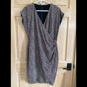 Women’s nearly new midi dress. 3/4 length. No tags-not sure of manufacturer.